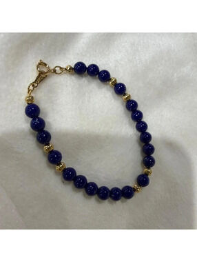 10- Avon Navy blue beaded bracelet with gold accents